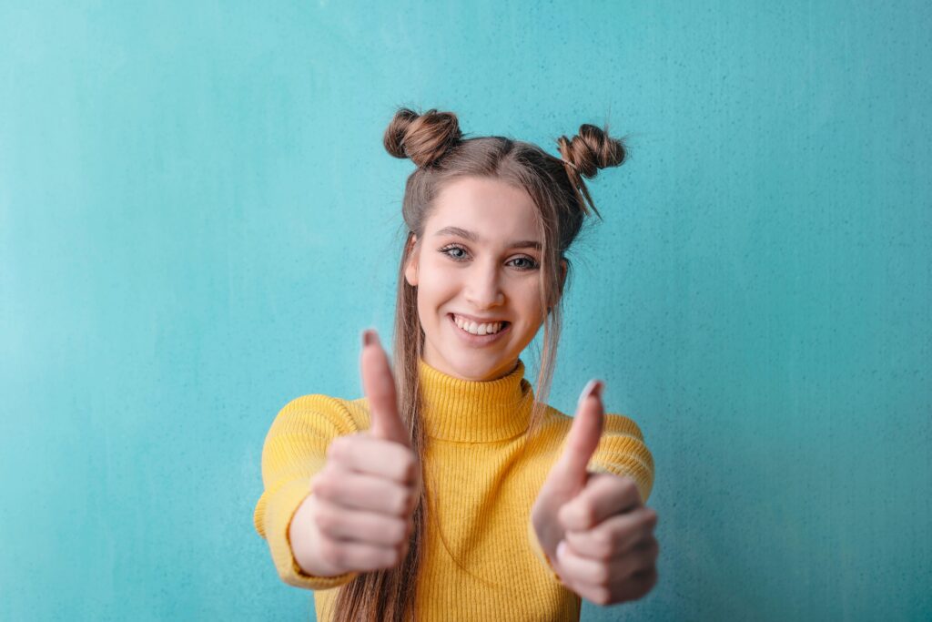 Woman in Yellow Turtleneck Sweater Smiling